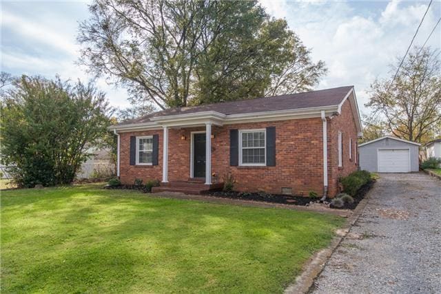 239 Sunrise Ave, Nashville, TN 37211 - ranch-style home featuring asphalt driveway, an outbuilding, brick siding, a front yard, and a detached garage