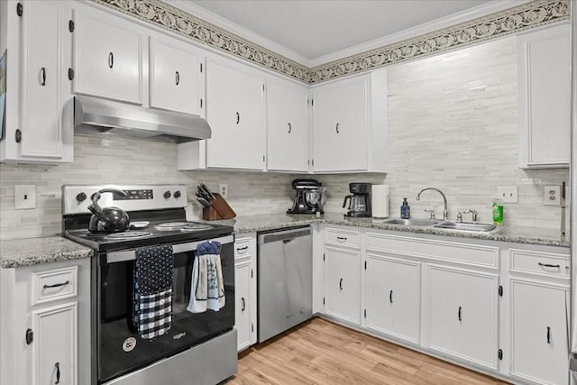 101 Cedar Hill Dr, Waverly, TN 37185 - kitchen with appliances with stainless steel finishes, under cabinet range hood, ornamental molding, backsplash, and white cabinetry