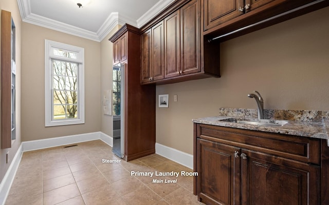 11 Saint Nicholas Way, Signal Mountain, TN 37377 - washroom with ornamental molding, hookup for a washing machine, cabinet space, and light tile patterned floors