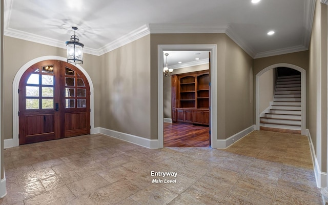 11 Saint Nicholas Way, Signal Mountain, TN 37377 - foyer featuring arched walkways, a chandelier, ornamental molding, stairway, and stone tile floors