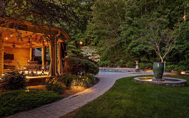 11 Saint Nicholas Way, Signal Mountain, TN 37377 - view of green lawn featuring a patio area, an outdoor pool, a view of trees, and ceiling fan