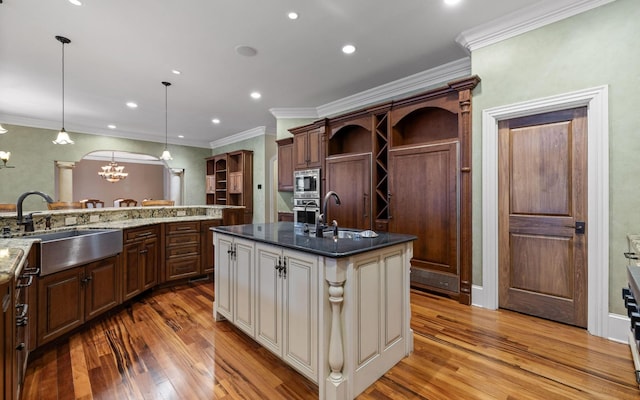 11 Saint Nicholas Way, Signal Mountain, TN 37377 - kitchen featuring appliances with stainless steel finishes, light wood-type flooring, a chandelier, open shelves, and ornamental molding