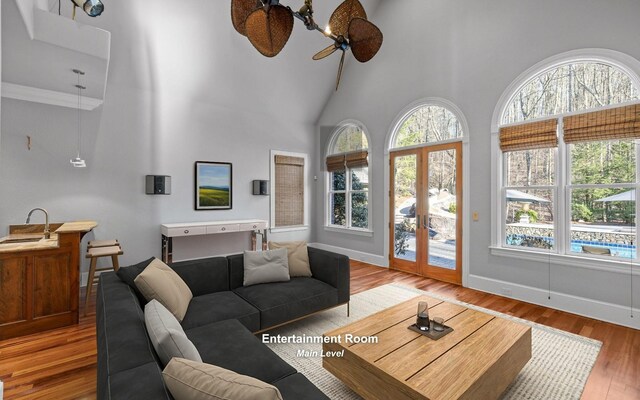 11 Saint Nicholas Way, Signal Mountain, TN 37377 - living room with a towering ceiling, plenty of natural light, wood finished floors, ceiling fan, and french doors
