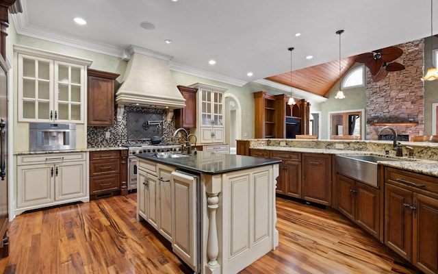 11 Saint Nicholas Way, Signal Mountain, TN 37377 - kitchen with custom exhaust hood, stainless steel appliances, cream cabinets, wood finished floors, and recessed lighting