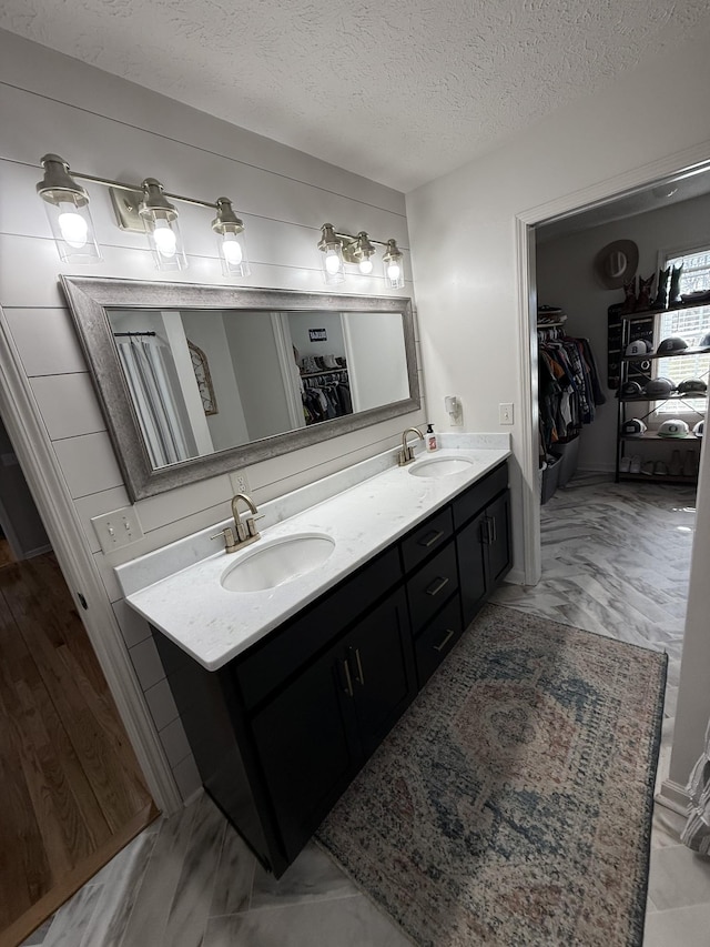 273 Old Coleytown Ln, Lafayette, TN 37083 - full bath with a walk in closet, double vanity, and a textured ceiling