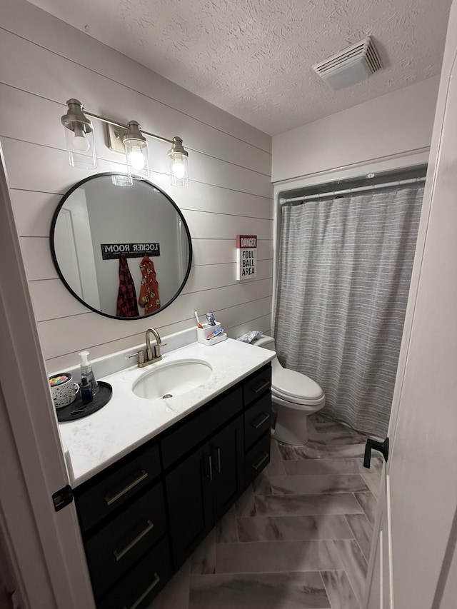 273 Old Coleytown Ln, Lafayette, TN 37083 - full bath with marble finish flooring, vanity, wood walls, a textured ceiling, and curtained shower