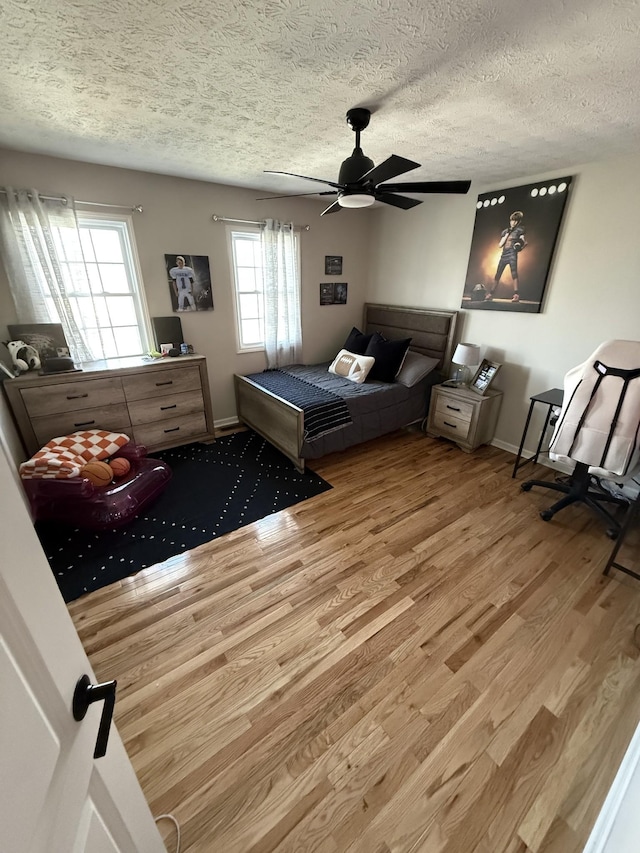 273 Old Coleytown Ln, Lafayette, TN 37083 - bedroom with wood finished floors, a textured ceiling, and a ceiling fan