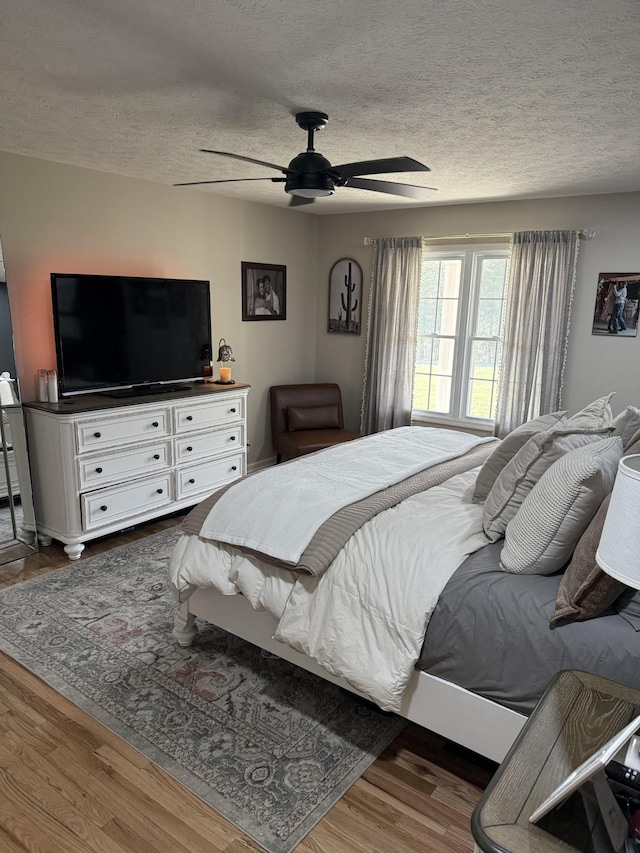 273 Old Coleytown Ln, Lafayette, TN 37083 - bedroom with wood finished floors, a textured ceiling, and a ceiling fan