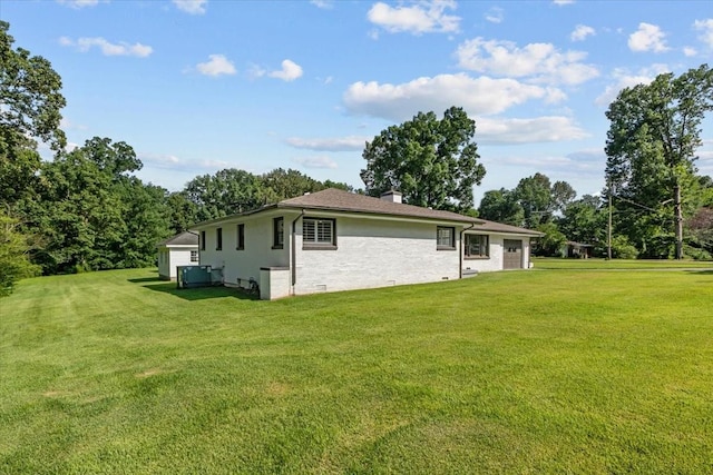 215 Sunset Dr, New Johnsonville, TN 37134 - view of home's exterior with a yard and a chimney