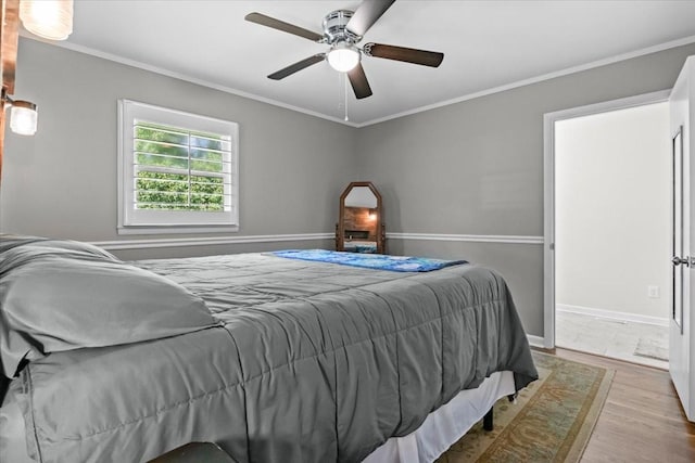 215 Sunset Dr, New Johnsonville, TN 37134 - bedroom featuring wood finished floors, crown molding, and a ceiling fan