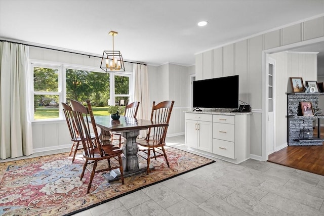 215 Sunset Dr, New Johnsonville, TN 37134 - dining space with healthy amount of natural light, crown molding, recessed lighting, a decorative wall, and a chandelier