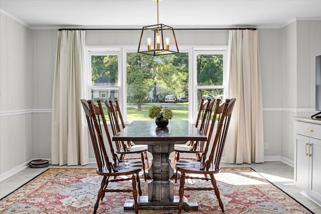 215 Sunset Dr, New Johnsonville, TN 37134 - dining space featuring a decorative wall, ornamental molding, and a chandelier