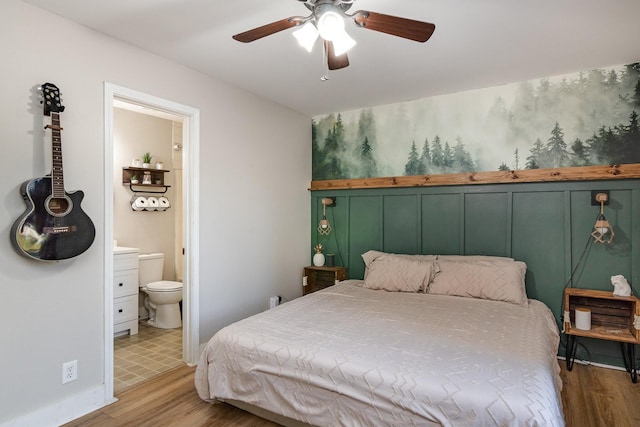 614 Joshua Dr, Clarksville, TN 37042 - bedroom with wood finished floors, ensuite bath, and a ceiling fan