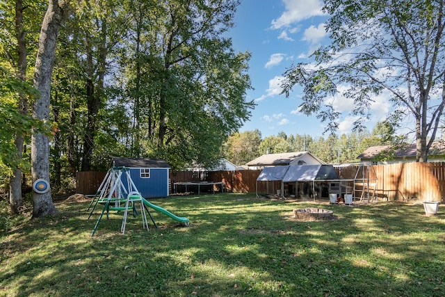 614 Joshua Dr, Clarksville, TN 37042 - fenced backyard with a storage shed and a fire pit