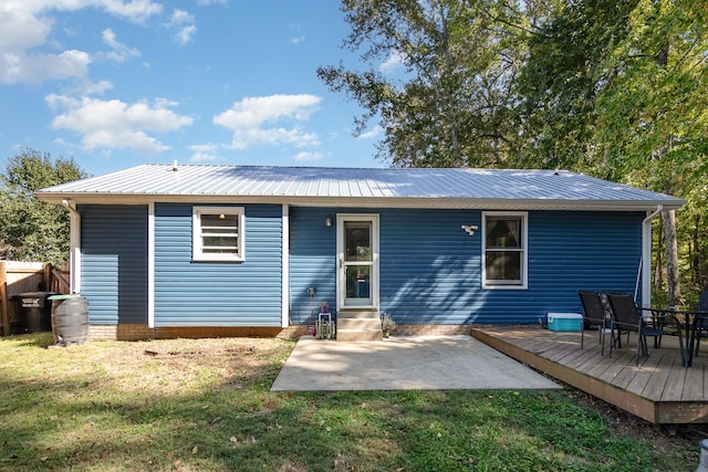 614 Joshua Dr, Clarksville, TN 37042 - back of house with entry steps, a lawn, and a metal roof