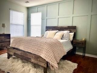 1869 Brookmeadow Ln, Hermitage, TN 37076 - bedroom with dark wood finished floors and a decorative wall