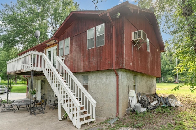 1205 Bloom Landing Rd, Charlotte, TN 37036 - back of property featuring stairway, a wooden deck, and a patio