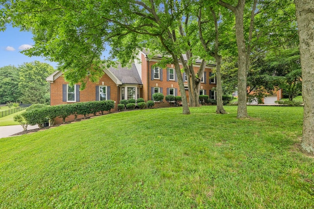 9214 Hunterboro Dr, Brentwood, TN 37027 - colonial-style house with brick siding and a front lawn