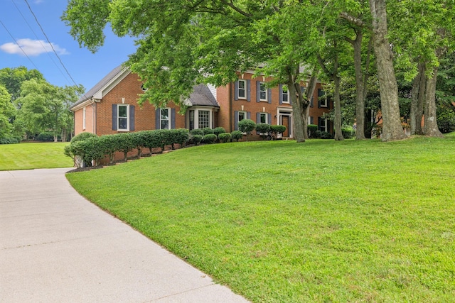 9214 Hunterboro Dr, Brentwood, TN 37027 - view of front of home featuring brick siding and a front yard
