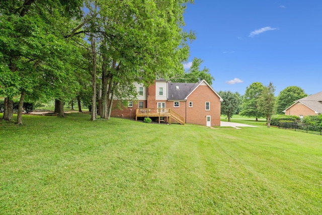 9214 Hunterboro Dr, Brentwood, TN 37027 - view of grassy yard with a deck and stairs