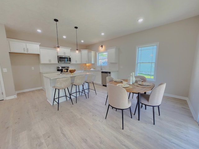 1204 Boulder Pass Rd, Clarksville, TN 37040 - dining space with light wood-style flooring and recessed lighting