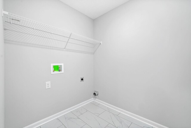 1204 Boulder Pass Rd, Clarksville, TN 37040 - laundry room featuring hookup for an electric dryer, washer hookup, and light marble finish flooring