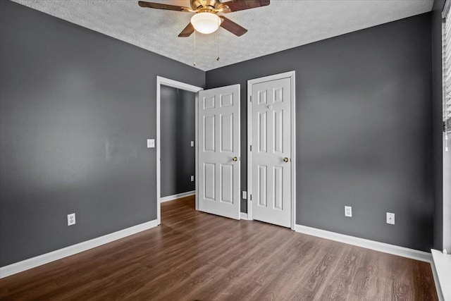 7173 New Hope Rd, Fairview, TN 37062 - unfurnished bedroom featuring wood finished floors, a textured ceiling, ceiling fan, and a closet