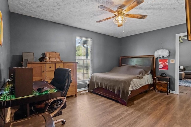 7173 New Hope Rd, Fairview, TN 37062 - bedroom with wood finished floors, an office area, a textured ceiling, and ceiling fan