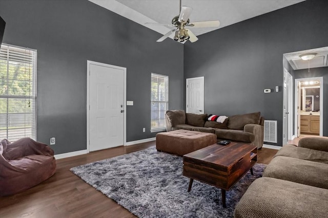 7173 New Hope Rd, Fairview, TN 37062 - living area with high vaulted ceiling, ceiling fan, attic access, and wood finished floors