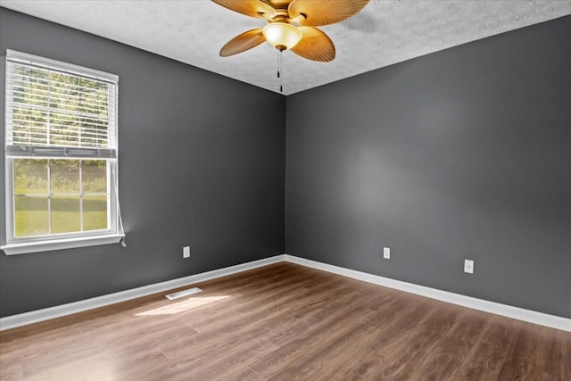 7173 New Hope Rd, Fairview, TN 37062 - unfurnished room featuring wood finished floors, ceiling fan, and a textured ceiling