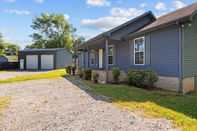 7173 New Hope Rd, Fairview, TN 37062 - view of front facade featuring an outbuilding, a garage, and covered porch