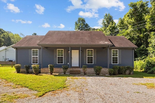 7173 New Hope Rd, Fairview, TN 37062 - view of front facade with covered porch, a front yard, and a shingled roof