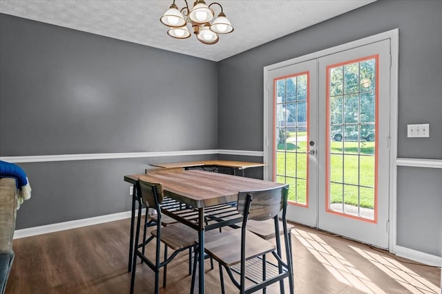 7173 New Hope Rd, Fairview, TN 37062 - dining area featuring a chandelier, wood finished floors, a textured ceiling, and french doors