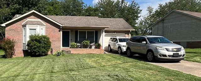512 Pointer Ln, Clarksville, TN 37042 - ranch-style house featuring concrete driveway, a garage, brick siding, and a front lawn