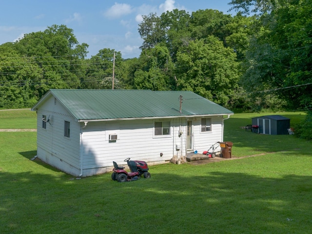 1532 Santa Fe Pike, Columbia, TN 38401 - rear view of house with a yard, a storage unit, and a metal roof