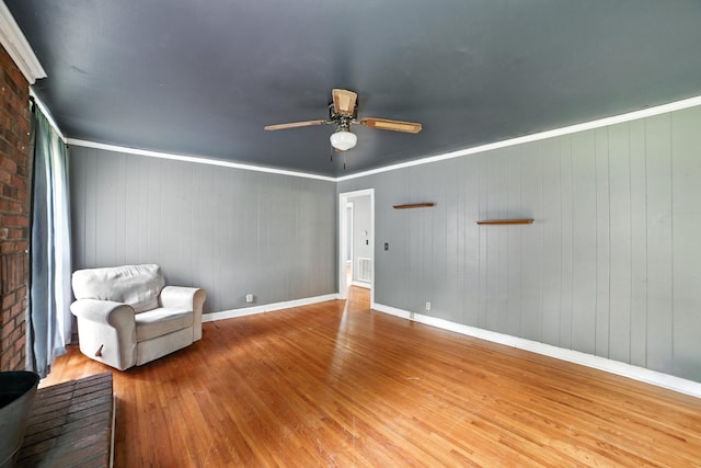 5125 Seward Rd, Brentwood, TN 37027 - living area featuring wood finished floors, a ceiling fan, and ornamental molding