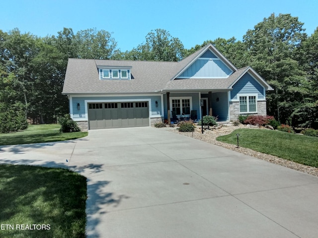 115 Bent Oak Ter, Crossville, TN 38558 - view of front of property featuring stone siding, a front lawn, and concrete driveway