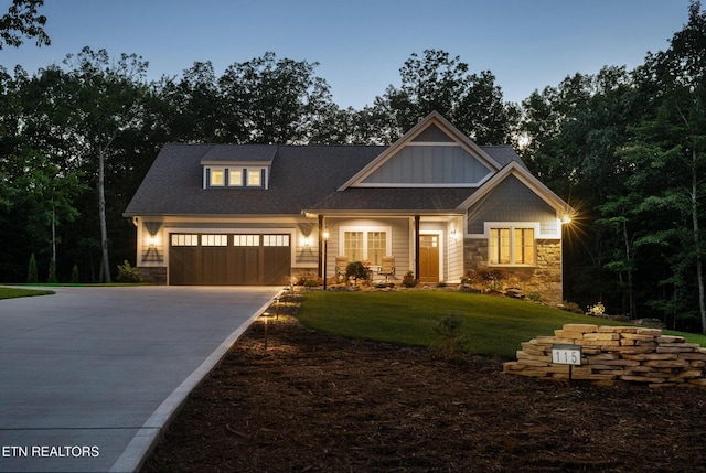 115 Bent Oak Ter, Crossville, TN 38558 - craftsman house with concrete driveway, board and batten siding, an attached garage, a front yard, and stone siding