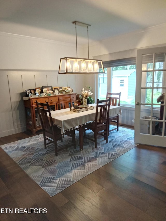 115 Bent Oak Ter, Crossville, TN 38558 - dining space featuring a decorative wall, wood finished floors, crown molding, and a wainscoted wall