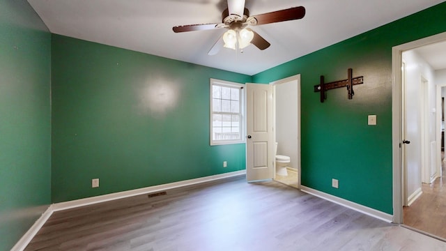 3388 Budds Creek Rd, Palmyra, TN 37142 - unfurnished bedroom with wood finished floors and a ceiling fan