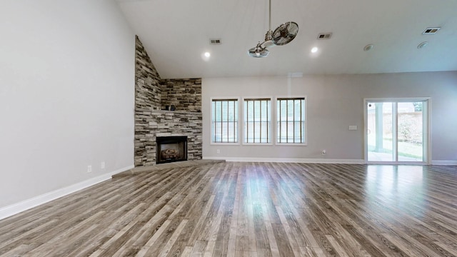 1012 Michaela Cir, Clarksville, TN 37043 - unfurnished living room featuring high vaulted ceiling, wood finished floors, healthy amount of natural light, and a fireplace