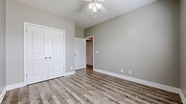 1012 Michaela Cir, Clarksville, TN 37043 - unfurnished bedroom with wood finished floors, a closet, and a ceiling fan