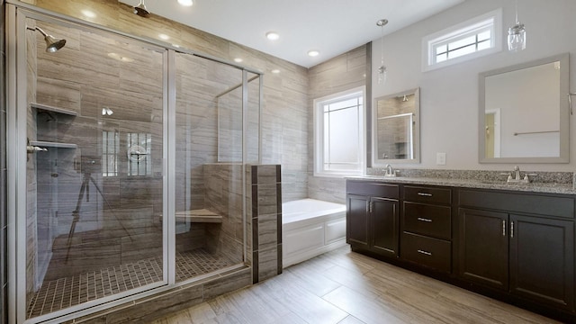 1012 Michaela Cir, Clarksville, TN 37043 - bathroom featuring a bath, double vanity, and a shower stall