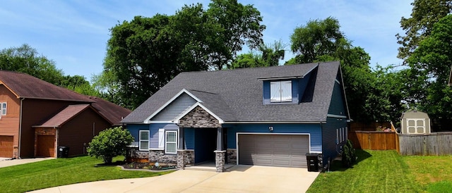 1012 Michaela Cir, Clarksville, TN 37043 - view of front facade featuring stone siding, concrete driveway, an attached garage, roof with shingles, and a shed