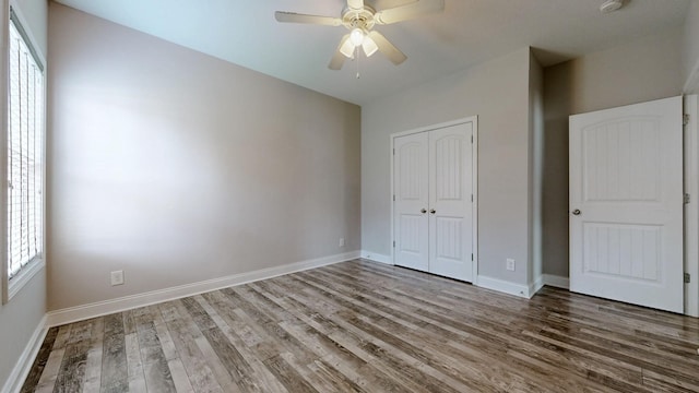 1012 Michaela Cir, Clarksville, TN 37043 - unfurnished bedroom with wood finished floors, a closet, and ceiling fan