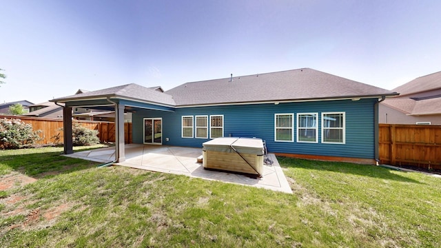 1012 Michaela Cir, Clarksville, TN 37043 - back of property featuring a patio area, a fenced backyard, a hot tub, and a shingled roof