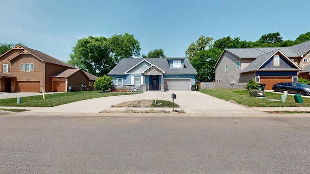 1012 Michaela Cir, Clarksville, TN 37043 - craftsman-style house with concrete driveway, a front lawn, a garage, and stone siding