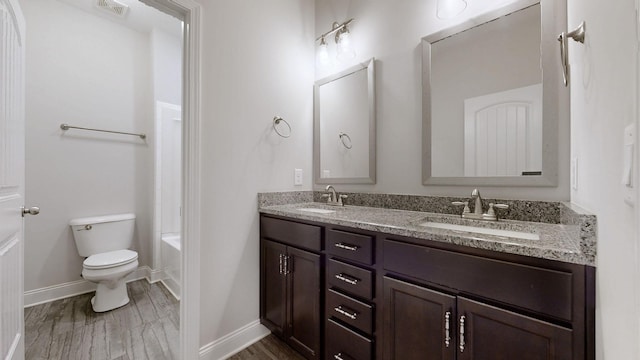 1012 Michaela Cir, Clarksville, TN 37043 - full bath with double vanity, wood finished floors, and shower / washtub combination