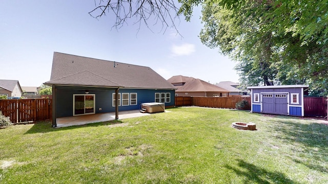 1012 Michaela Cir, Clarksville, TN 37043 - rear view of house featuring an outdoor fire pit, a fenced backyard, a storage shed, a patio area, and roof with shingles