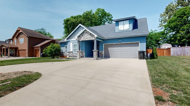 1012 Michaela Cir, Clarksville, TN 37043 - craftsman house with concrete driveway, stone siding, an attached garage, and roof with shingles